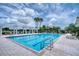 Enjoy a large community swimming pool featuring lane dividers, lounge chairs, and poolside amenities for relaxation at 2333 Pinehurst Ct, Davenport, FL 33837