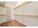 Spacious walk-in closet with custom wood shelving and plenty of storage at 2333 Pinehurst Ct, Davenport, FL 33837
