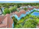 Beautiful condo community with well-manicured lawns, a serene pond, and a tennis court at 2743 N Poinciana Blvd # 55, Kissimmee, FL 34746