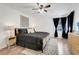 Stylish bedroom with modern furniture, sleek hardwood floors, and abundant natural light offers a welcoming retreat at 2743 N Poinciana Blvd # 55, Kissimmee, FL 34746