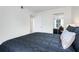 Bright bedroom with a view to another room through the bedroom door, light colored walls, and mirrored closet at 2743 N Poinciana Blvd # 55, Kissimmee, FL 34746