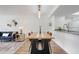 Dining area features modern lighting, a wooden table, and a view into the living space at 2743 N Poinciana Blvd # 55, Kissimmee, FL 34746