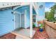 Inviting condo entrance with charming blue siding and red mulch at 2743 N Poinciana Blvd # 55, Kissimmee, FL 34746