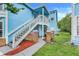 Lovely condo featuring a staircase, fresh exteriors, and beautifully landscaped surroundings at 2743 N Poinciana Blvd # 55, Kissimmee, FL 34746