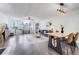 Open-concept space featuring a dining area, living area, large windows, and modern decor at 2743 N Poinciana Blvd # 55, Kissimmee, FL 34746