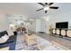 Open-concept living area showing the entryway, kitchen bar, and stylish furniture at 2743 N Poinciana Blvd # 55, Kissimmee, FL 34746