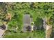 Overhead aerial view of home, showcasing the roof, driveway, and surrounding trees at 304 W 24Th St, Sanford, FL 32771