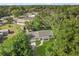 Aerial view of a home with a well-maintained yard surrounded by lush greenery at 304 W 24Th St, Sanford, FL 32771
