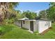 Spacious backyard showing the exterior of the home with a well-manicured lawn at 304 W 24Th St, Sanford, FL 32771