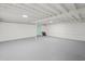 Spacious unfinished basement with painted floors and ceiling, offering versatile storage potential at 304 W 24Th St, Sanford, FL 32771
