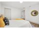 Cozy bedroom featuring a comfortable bed, closet space, a white door, and modern decor at 304 W 24Th St, Sanford, FL 32771