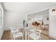 Bright dining room with a glass table and a view into the spacious living area at 304 W 24Th St, Sanford, FL 32771
