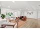 Bright and airy living room featuring sleek flooring, contemporary furnishings, and an inviting atmosphere at 304 W 24Th St, Sanford, FL 32771
