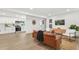 Bright and airy living room featuring sleek flooring and views into the modern kitchen at 304 W 24Th St, Sanford, FL 32771