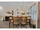 Inviting dining room featuring stylish decor and a wooden dining set for comfortable Gathering meals at 3193 Whispering Trails Ave, Winter Haven, FL 33884