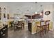 Open floor plan featuring a kitchen with a breakfast bar and stainless steel appliances, plus a dining area at 3193 Whispering Trails Ave, Winter Haven, FL 33884