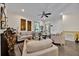 Bright living room featuring neutral sofas, contemporary art, and plenty of natural light from the windows at 3193 Whispering Trails Ave, Winter Haven, FL 33884