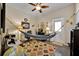 Bright office space features a ceiling fan, desk area, and a hammock for relaxation at 3193 Whispering Trails Ave, Winter Haven, FL 33884