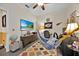 Comfortable office space features a ceiling fan, desk, and a hammock for relaxation at 3193 Whispering Trails Ave, Winter Haven, FL 33884