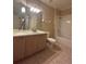 Well-lit bathroom featuring a vanity, toilet, and bathtub with shower at 3244 River Branch Cir, Kissimmee, FL 34741