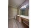 Bathroom features a long vanity with mirror and a walk-in shower at 3244 River Branch Cir, Kissimmee, FL 34741