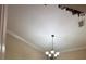 Detailed ceiling and chandelier add elegance to the room at 3244 River Branch Cir, Kissimmee, FL 34741