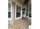 Inviting entryway showcasing large windows and decorative tiled flooring at 3244 River Branch Cir, Kissimmee, FL 34741
