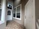 Home featuring tiled entry with access to a side door and main front door at 3244 River Branch Cir, Kissimmee, FL 34741