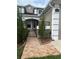 Home featuring decorative wrought iron gate, and attractive tiled front entryway at 3244 River Branch Cir, Kissimmee, FL 34741