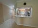 Open kitchen view showcases light-colored cabinets and countertops with updated stainless steel appliances at 3244 River Branch Cir, Kissimmee, FL 34741
