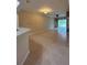 Open-concept living room features tiled flooring, ceiling fan, and sliding glass doors at 3244 River Branch Cir, Kissimmee, FL 34741