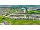 An aerial view showcases the neighborhood with lakes and extensive housing at 328 Toldedo Rd, Davenport, FL 33837