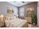 Cozy bedroom with ceiling fan, natural light, and rustic accents at 328 Toldedo Rd, Davenport, FL 33837