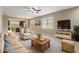 Comfortable living room with neutral tones, tile floors, and a ceiling fan at 328 Toldedo Rd, Davenport, FL 33837