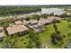 A high definition aerial view displays backyard, patio, lawn and surrounding homes at 3759 Eagle Isle Cir, Kissimmee, FL 34746