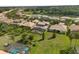 Aerial view of a beautiful home with a screened-in patio and lush green lawn at 3759 Eagle Isle Cir, Kissimmee, FL 34746