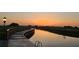 Boardwalk and waterway at sunset. Scenic view provides relaxation and recreation at 3759 Eagle Isle Cir, Kissimmee, FL 34746