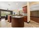 Gourmet kitchen featuring granite countertops, custom cabinets, and open access to adjacent rooms at 3759 Eagle Isle Cir, Kissimmee, FL 34746