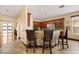 Open kitchen features a breakfast bar with stone accents and counter seating at 3759 Eagle Isle Cir, Kissimmee, FL 34746
