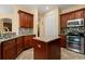 Kitchen with a center island, stainless steel appliances, and wood cabinetry at 3759 Eagle Isle Cir, Kissimmee, FL 34746