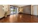 Cozy living room featuring hardwood floors, access to the patio, designer accent wall and recessed lighting at 3759 Eagle Isle Cir, Kissimmee, FL 34746