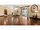 Bright living room showcasing hardwood floors, access to patio, open layout, and stylish decor at 3759 Eagle Isle Cir, Kissimmee, FL 34746