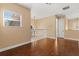Open loft area with hardwood floors, a chandelier, and a view from the window, creating a relaxing ambiance at 3759 Eagle Isle Cir, Kissimmee, FL 34746