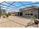 Spacious screened-in patio featuring tile flooring and an outdoor seating area at 3759 Eagle Isle Cir, Kissimmee, FL 34746