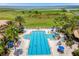 Overhead shot showcasing the beautiful community pool, with a variety of seating at 3759 Eagle Isle Cir, Kissimmee, FL 34746