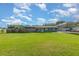 Charming single-story home with a well-maintained lawn, car port, and a fenced backyard at 3824 Hickory Tree Rd, St Cloud, FL 34772