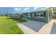Exterior of the home shows a well-manicured lawn, a fenced-in yard, and a quaint sidewalk at 3824 Hickory Tree Rd, St Cloud, FL 34772