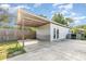 Detached garage with carport on a concrete driveway at 3824 Hickory Tree Rd, St Cloud, FL 34772