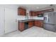 Updated kitchen with stainless steel appliances, dark cabinetry, and sleek countertop at 3824 Hickory Tree Rd, St Cloud, FL 34772