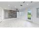 Bright living room with marble flooring, updated wall, and recessed lighting at 3824 Hickory Tree Rd, St Cloud, FL 34772